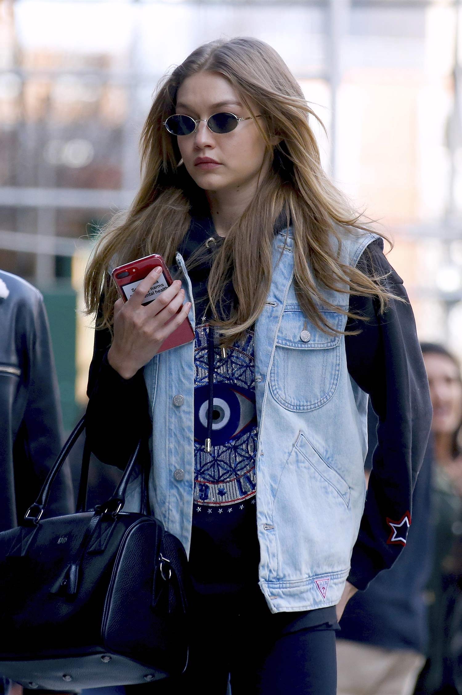 Gigi Hadid Wears A GUESS Denim Vest - THE JEANS BLOG