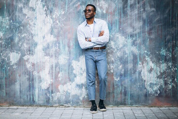 man in cropped jeans and sneakers