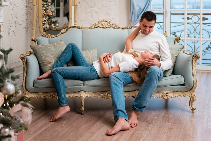 couple relaxing on ornate sofa