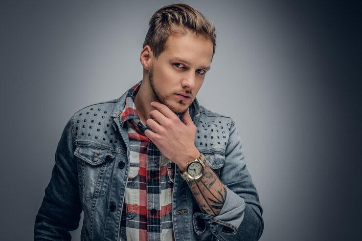 man in denim jacket and plaid shirt